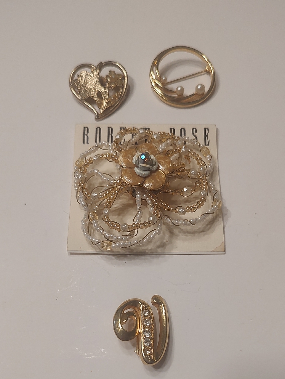 Lot of vintage or NWT gold tone pendants X 4, Avon, Coro, Monet & Robert Rose